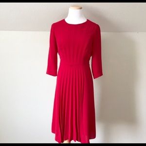 Pleated midi dress. Red dress